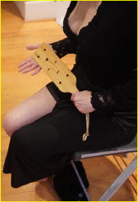 Egyptian domme in London with spanking paddle