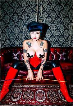 Strict London dominatrix Madam Helle with cane