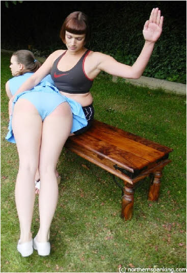 Cheerleader spanked in uniform by Leia-Ann Woods